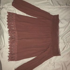 Off the shoulder pink blouse.